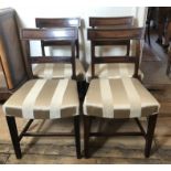 A SET OF FOUR 19TH CENTURY SHERATON DESIGN DINING CHAIRS With overstuffed upholstered seats.