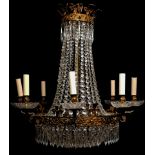 A 19TH CENTURY FRENCH GILT METAL EIGHT BRANCH CHANDELIER Decorated with Fleur-De-Lis motifs and
