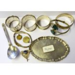 A SELECTION OF SILVERWARE ITEMS Comprising a Royal Danish silver spoon, a pair of Edwardian napkin