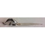 A 20TH CENTURY SWISS SILVER FIGURAL LETTER OPENER The handle formed as a stylized fish, the blade