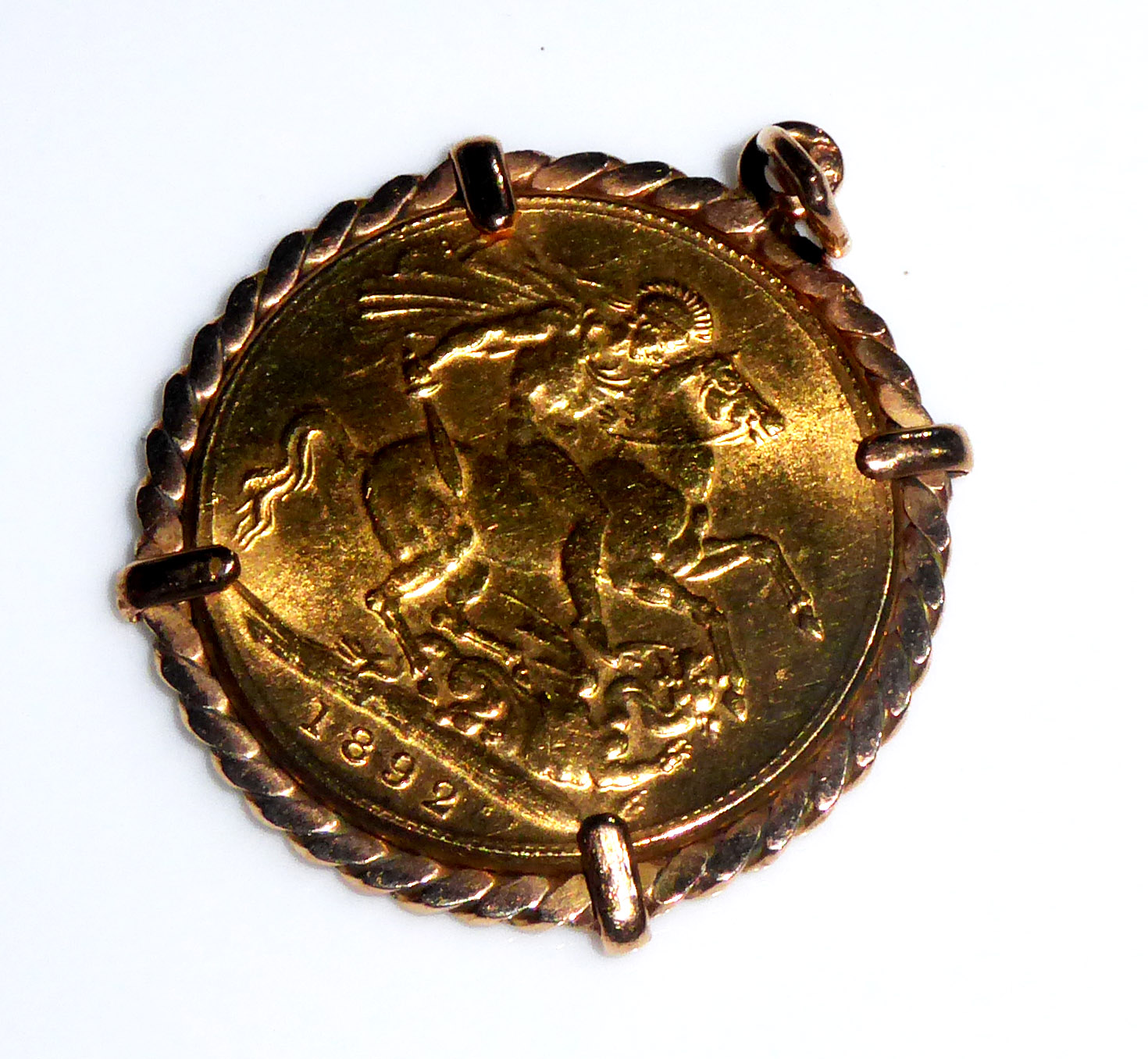 A VICTORIAN 22CT GOLD FULL SOVEREIGN Dated 1892, mounted in pendant form with a rope twist shank.