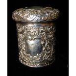 AN EDWARDIAN SILVER TRINKET CYLINDRICAL BOX With scrolled decoration, hallmarked Birmingham,