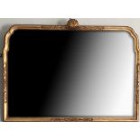 A QUEEN ANNE DESIGN GILT FRAMED MIRROR, CIRCA 1920 With central shell above silvered plate. (77cm