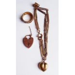 A 9CT GOLD BRACELET Having two 9ct gold charms, heart and cup, together with a heart form padlock