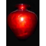 A 20TH CENTURY SPANISH RED GLASS OVOID VASE With everted rim. (h 36cm)