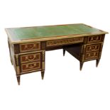 MANNER OF GUILLAUME BENNEMAN, A MID 20TH CENTURY FRENCH ORMOLU MOUNTED MAHOGANY BUREAU-A-CAISSONS