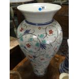 A LARGE FLOOR STANDING VASE WITH FLORAL HAND PAINTED DECORATION