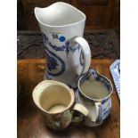 3 ASSORTED JUGS . 2 BLUE AND WHITE CERAMIC JUGS AND 1 SMALL ROYAL DAULTON