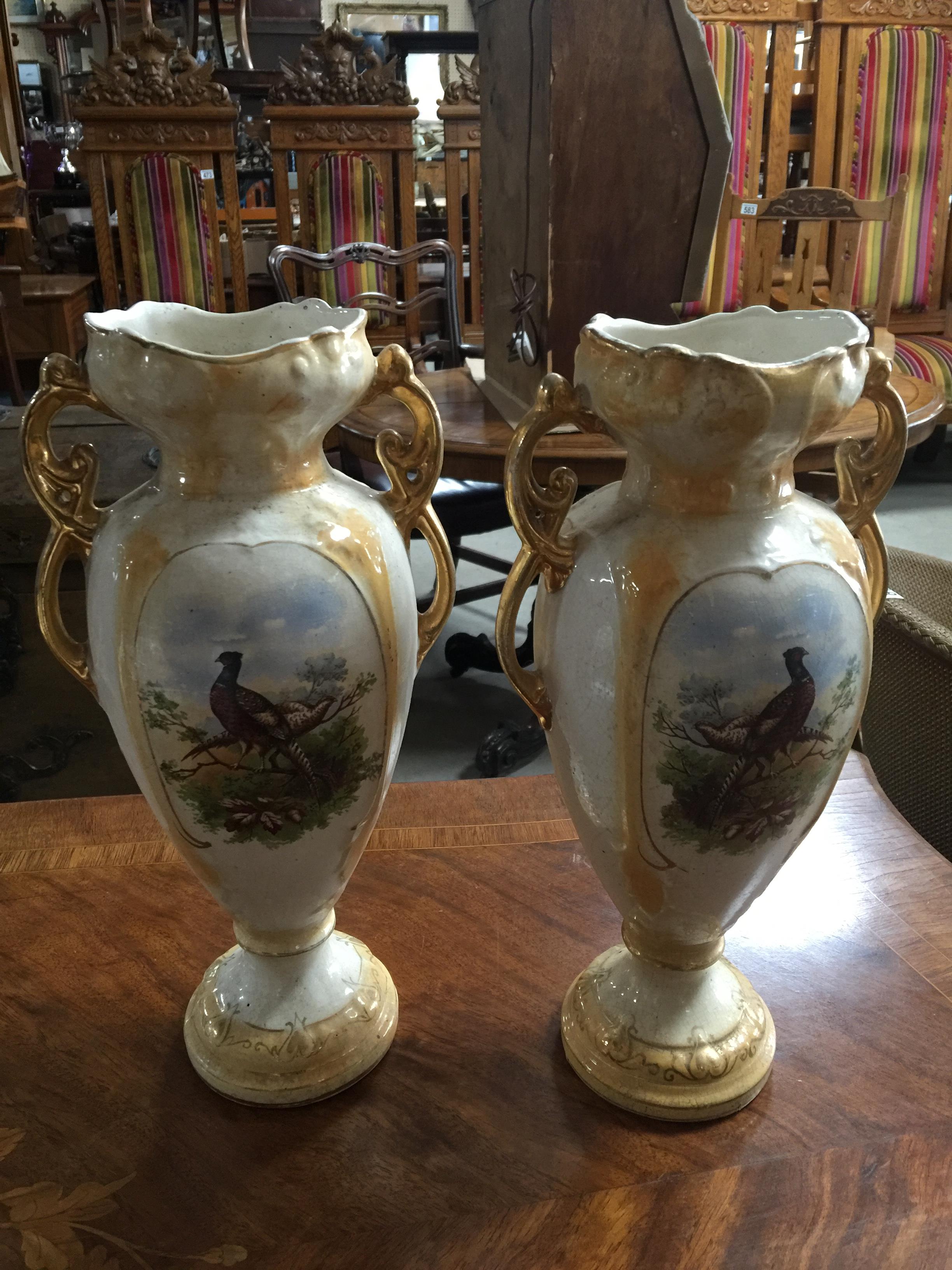 PAIR OF CERAMIC URNS WITH GUILT DECORATION AND PAINTED SCENES OF PHEASANTS