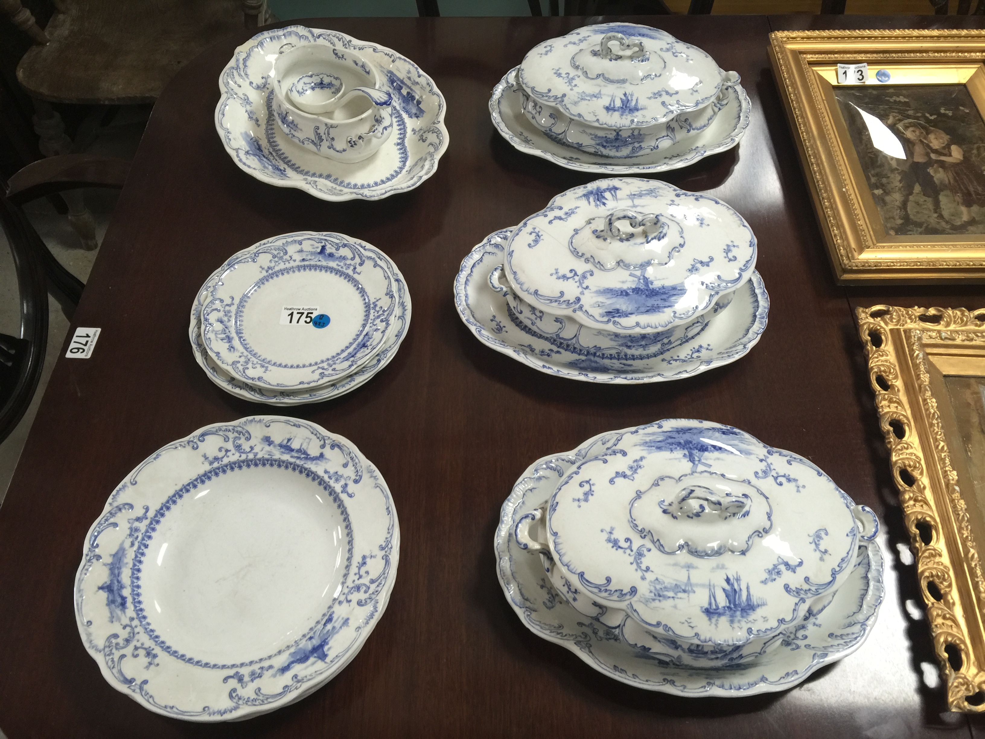 AN EARLY 20TH CENTURY BLUE AND WHITE PART DINNER SET COMPRISING OF THREE OVAL TUREENS 2 SERVING