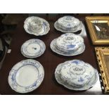 AN EARLY 20TH CENTURY BLUE AND WHITE PART DINNER SET COMPRISING OF THREE OVAL TUREENS 2 SERVING