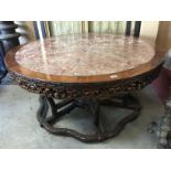 LARGE CIRCULAR TURN OF THE CENTURY CHINESE RED ONYX TABLE