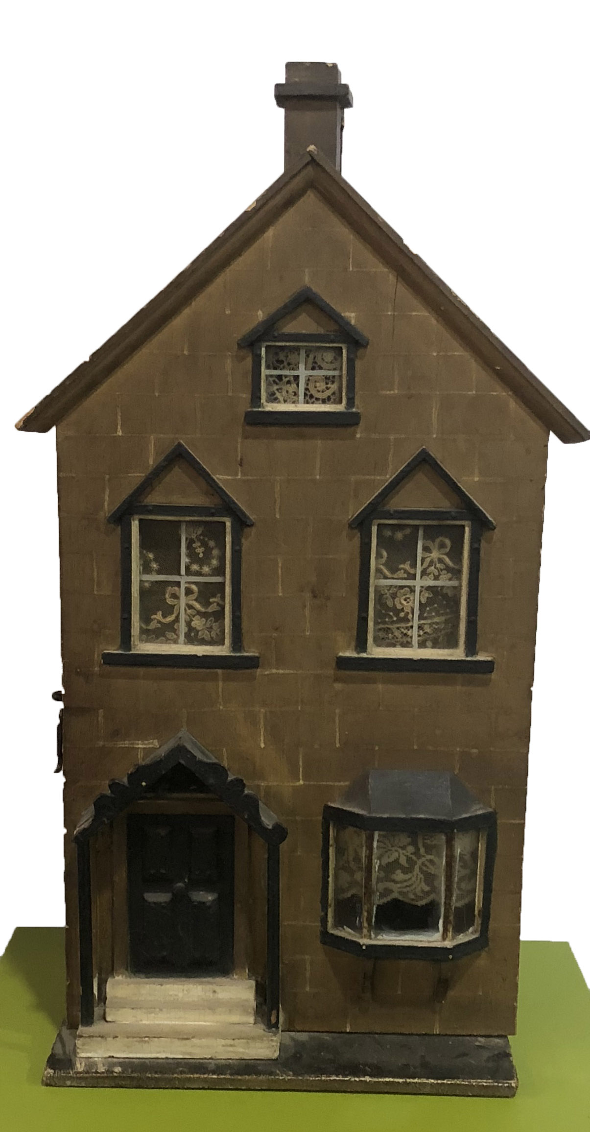 A LATE 19TH/EARLY 20TH CENTURY WOODEN DOLLS HOUSE Spread over three floors with steps to door with