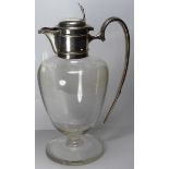 AN EDWARDIAN SILVER AND GLASS OVOID CLARET JUG The plain silver handle and collar, hallmarked