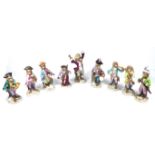 A 20TH CENTURY GERMAN PORCELAIN MONKEY BAND SET Comprising a conductor and eight musicians in period