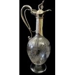 A VICTORIAN SILVER AND ETCHED GLASS CLARET JUG The vine and grape finial opening with a trigger grip