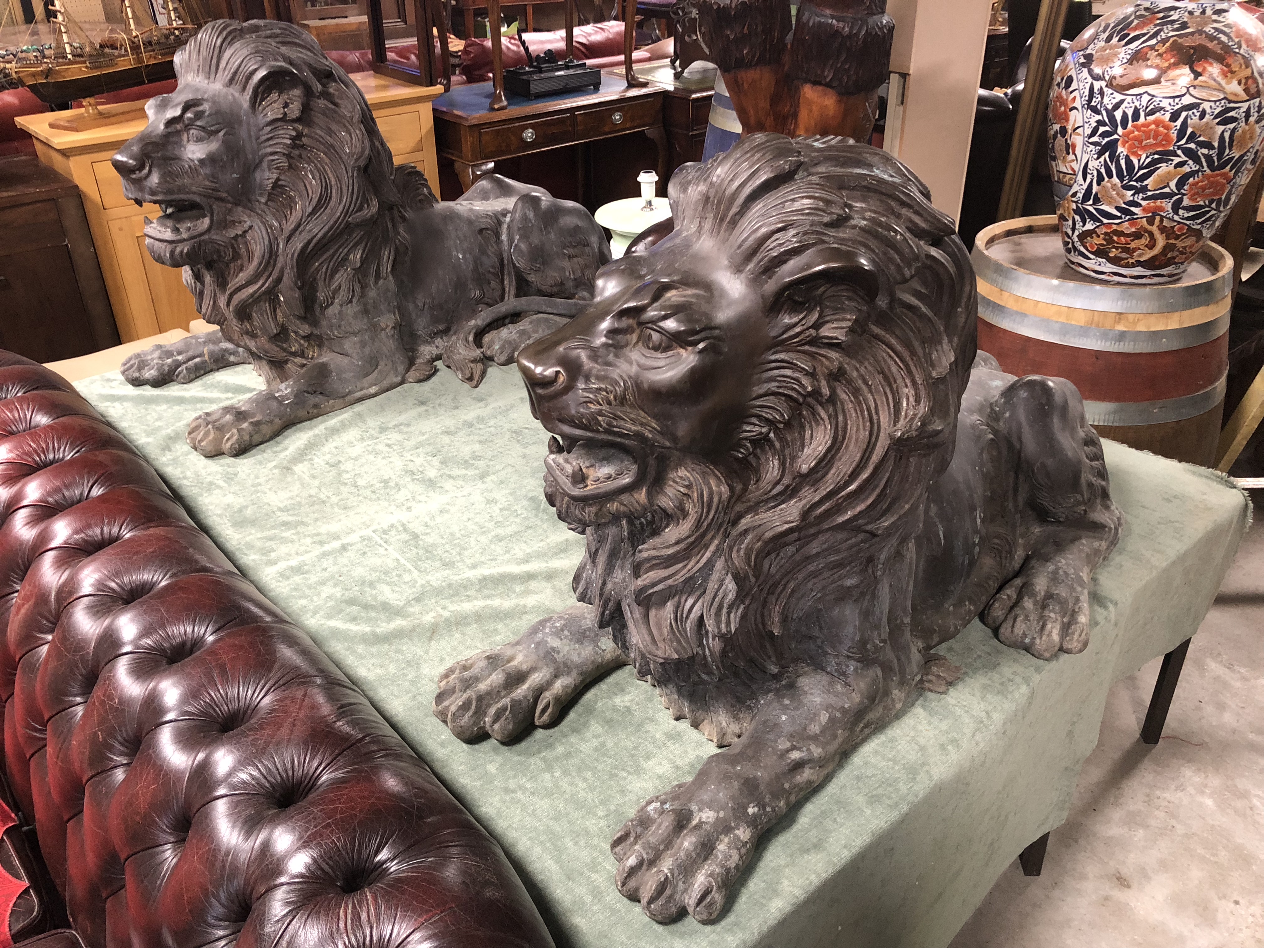 PAIR OF LARGE BRONZE CAST LIONS RECUMBENT GOOD CONDITION H X 70CM D X 117CM W X 53CM