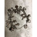 SOLID SILVER CHARM BRACELET WITH 20 CHARMS GOOD CONDITION