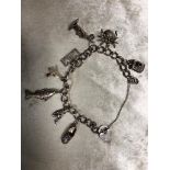 SOLID SILVER CHARM BRACELET WITH 8 CHARMS