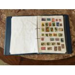 AN ALBUM CONTAINING 20TH CENTURY WORLD STAMPS. TO INCLUDE WORLD WAR II POLISH, NAZI, GERMAN,