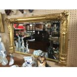 A 19TH CENTURY CARVED GILTWOOD OVER MANTLE MIRROR H X 68 D X 8 W X 109