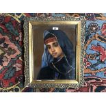 A GILT FRAMED OIL PAINTING PORTRAIT OF A MIDDLE EASTERN BOY IN TRADITIONAL DRESS