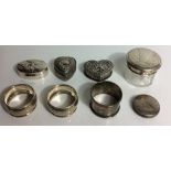 A COLLECTION OF FOUR VINTAGE SILVER TRINKET BOXES To include two heart form with embossed