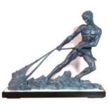 A LARGE ART DECO BRONZE SCULPTURE OF AN ATHLETE GATHERING A FISHING NET Raised on a black marble