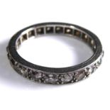 AN EARLY 20TH CENTURY WHITE METAL AND DIAMOND ETERNITY RING The single row of round cut diamonds