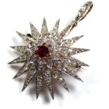 AN EARLY 20TH CENTURY FRENCH 18CT GOLD, NATURAL SPINEL AND DIAMOND STAR BROOCH The single round