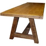 A PINE REFECTORY TABLE The 6cm plank top raised on square stile supports, joined by a stretcher. (