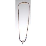 A VINTAGE 18CT GOLD, DIAMOND AND SAPPHIRE NECKLACE The arrangement of round cut diamonds