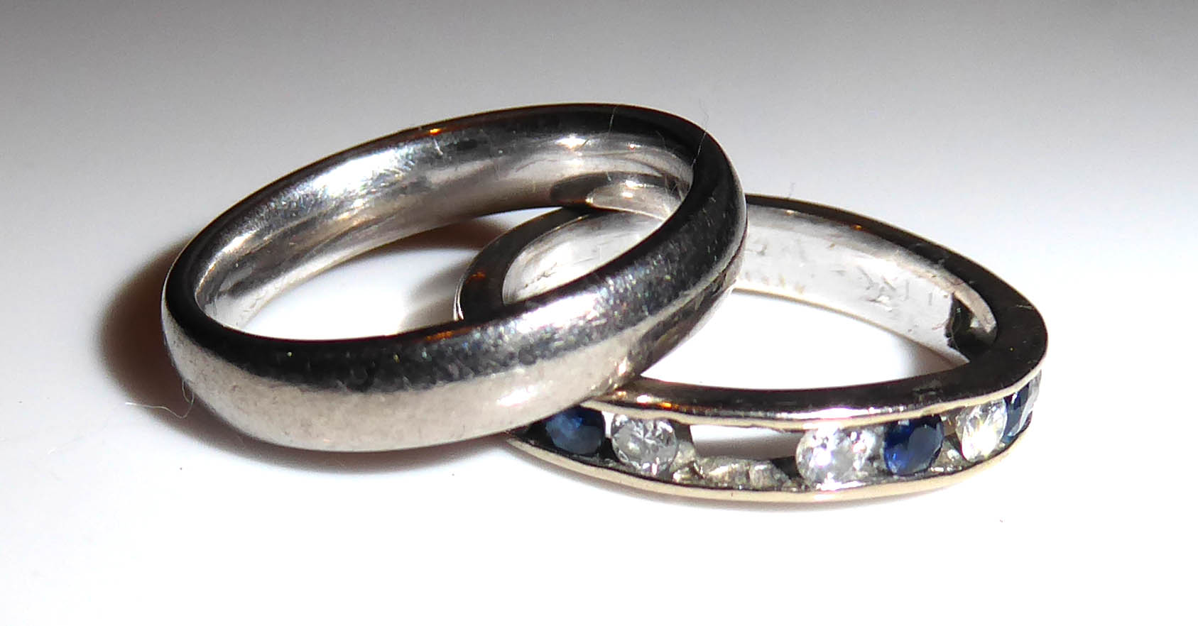 TWO VINTAGE 18CT WHITE GOLD RINGS To include a half eternity ring set with a row of round cut
