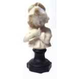 AN EARLY 20TH CENTURY ITALIAN ALABASTER BUST Carved as a young girl holding a dove, signed to