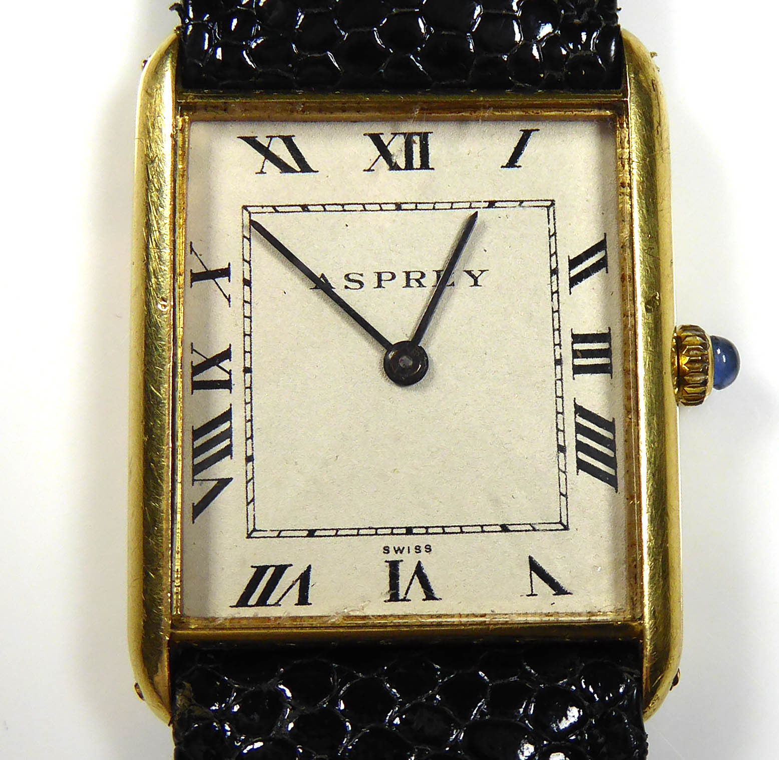 ASPREY, A VINTAGE 18CT GOLD GENT'S WRISTWATCH The rectangular dial with sapphire set winder,