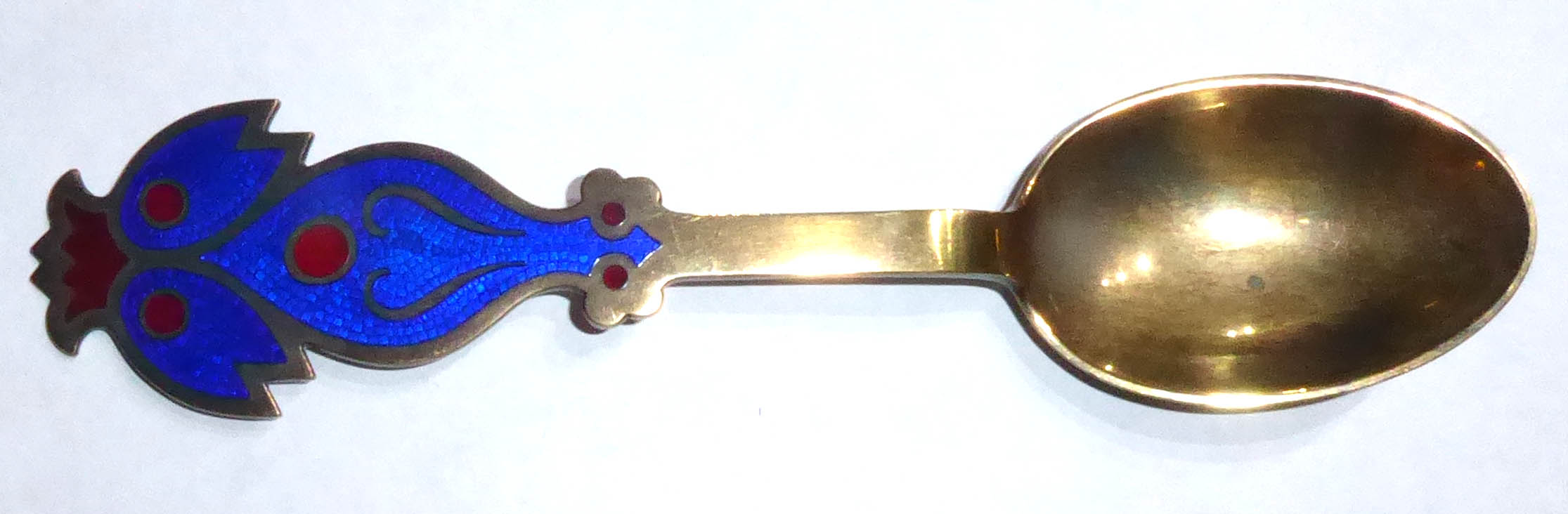 A. MICHELSON, DENMARK, A 20TH CENTURY SILVER AND ENAMEL SPOON Enamelled with a stylized bird with