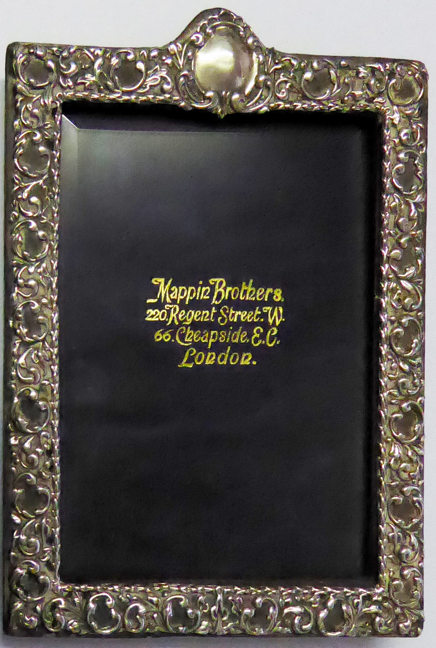 MAPPIN & WEBB, A VICTORIAN RECTANGULAR EASLE PHOTOGRAPH FRAME With scrolled decoration, hallmarked