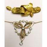 AN EDWARDIAN 9CT GOLD, SEED PEARL AND PASTE SET NECKLACE Entwined with a row of pale blue paste