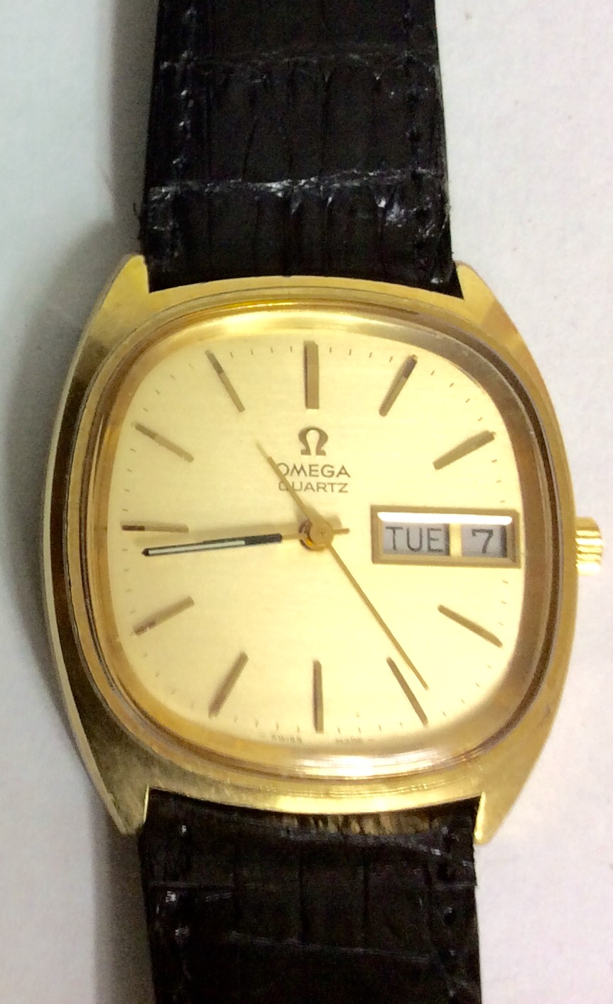 OMEGA, A VINTAGE GOLD PLATED GENT'S WRISTWATCH Having a rectangular gold tone dial with calendar