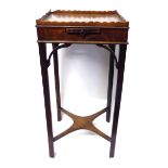 A GEORGE III MAHOGANY KETTLE STAND With gallery top over brushing slide, raised on square