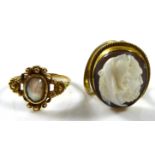 A GEORGIAN YELLOW METAL AND MOTHER OF PEARL RING The oval cut pearl held in a scrolled mount,