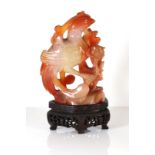 A CHINESE CARVED AGATE FIGURAL GROUP Finely carved as two exotic birds and raised on a pierced