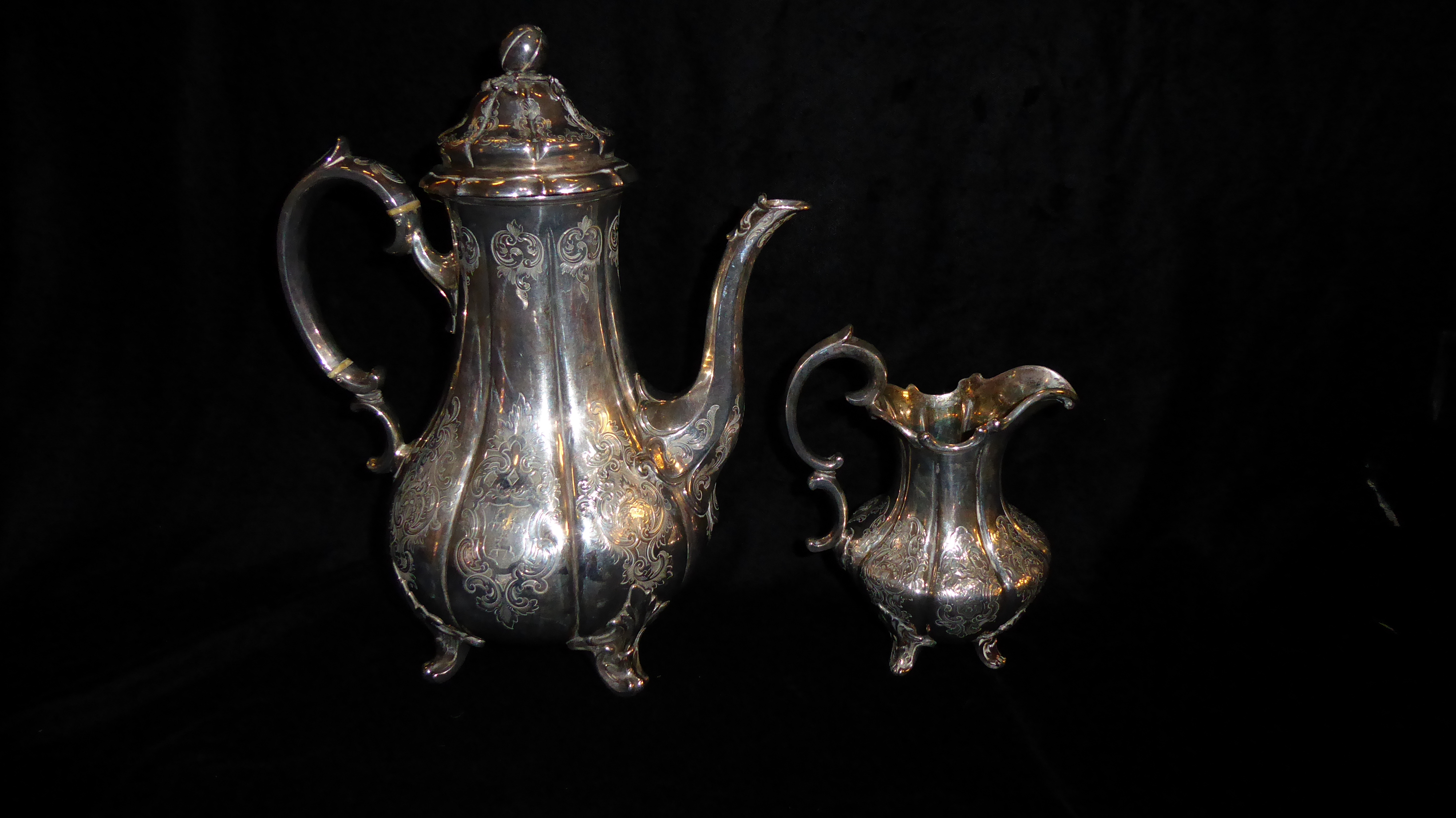 A VICTORIAN SILVER COFFEE POT AND CREAM JUG Having a melon form finial with fluted body,