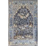 AN ISFAHAN SILK AND WOOL RUG Embroidered with the Tree of Life, with exotic birds surrounded by