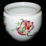 A CHINESE FAMILLE ROSE PORCELAIN VASE Hand painted with peaches and exotic fruit, bearing a red