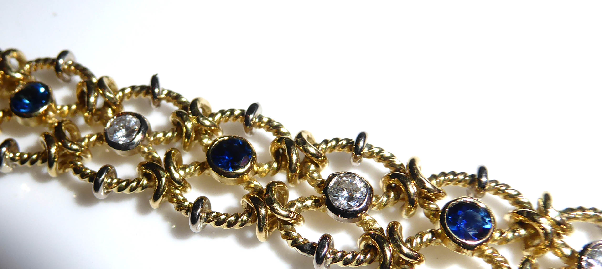 A VINTAGE YELLOW META, DIAMOND AND SAPPHIRE BRACELET The row of round cut diamonds interspersed with - Image 2 of 2