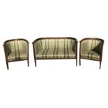 AN EDWARDIAN MAHOGANY, SATINWOOD AND STRING INLAID THREE PIECE SUITE Comprising a sofa and a pair of