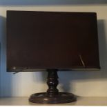 A VICTORIAN MAHOGANY ADJUSTABLE TABLE TOP BOOK STAND Supported on a turned column and platform base.