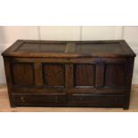AN 18TH CENTURY OAK MULE CHEST The rising hinged lid above a pair of short drawers fitted with