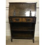 A 19TH CENTURY SOLID OAK STUDENT'S BUREAU. (h 104cm x w 66cm x depth 28cm)